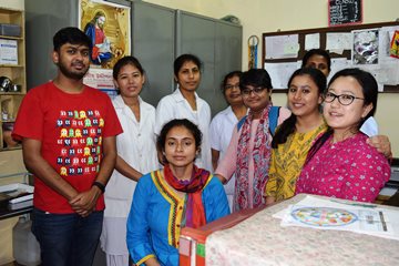 Fellows (from left) Soumya Bhowmick, Sudeshna Dutta, Purbasha Auddy, Mayuri Banerjee, and Kheya Samaddar with the hospital’s staff (in white).
