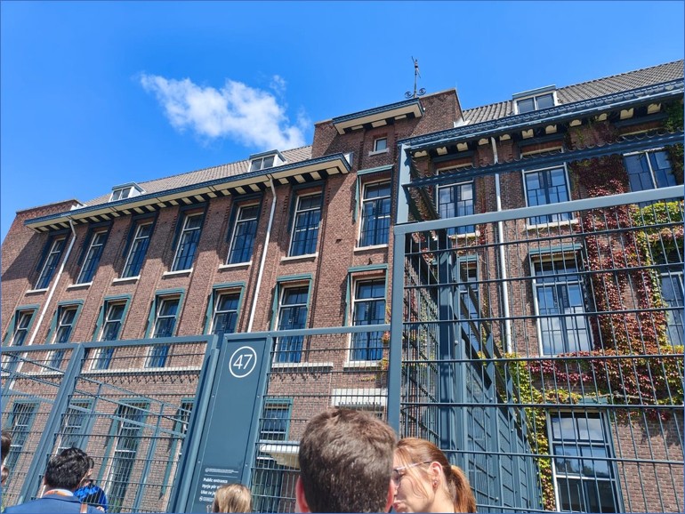 The Kosovo Specialist Chambers was formerly Europol’s headquarters and later repurposed as a criminal court. The carceral aesthetic is visible in the security fencing and gated entrance. (Photo by the author)